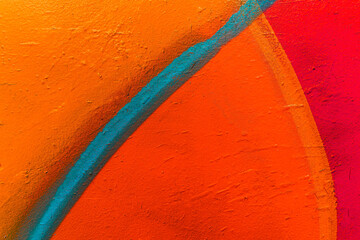 Beautiful brick wall colorful street art graffiti background. Abstract creative spray drawing fashion colors painting on the walls of the city. Urban Culture, aerosol texture