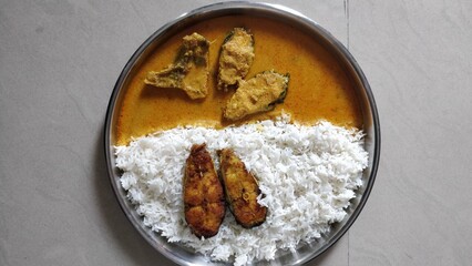 Spicy silver fish curry gravy , cooking spicy fish curry rice Goan red curry. Indian Bengali masala seafood.