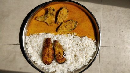 Spicy silver fish curry gravy , cooking spicy fish curry rice Goan red curry. Indian Bengali masala seafood.