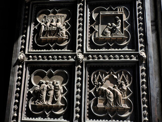 gold door sculptures Florence dome cathedral complex exterior detail