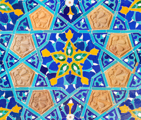 Old tiles background. Vintage colored ceramics with a pattern on the facade