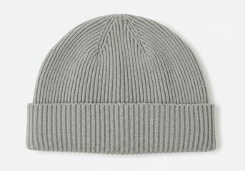 A close up shot of a gray ribbed knit beanie hat isolated on a plain white background surface view