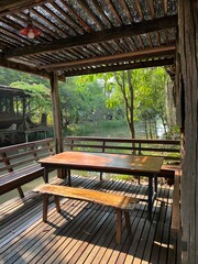 Rustic outdoor seating area surrounded by nature.
