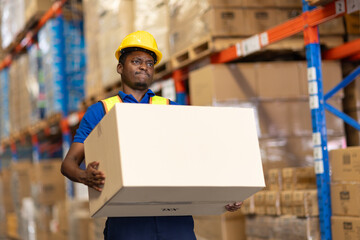 warehouse worker carrying lifting very heavy weight box moving storage box in cargo muscle back pain