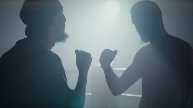 African American boxers greet with hand gesture at ring sparring
