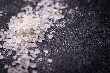 Natural sea salt crystals on dark background