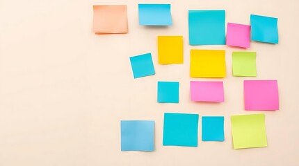 Assorted Blank Colorful Sticky Notes on a Beige Wall with Copy Space