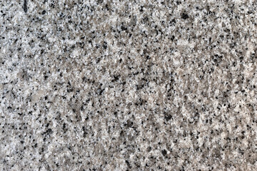 Granite natural textured background, close-up view
