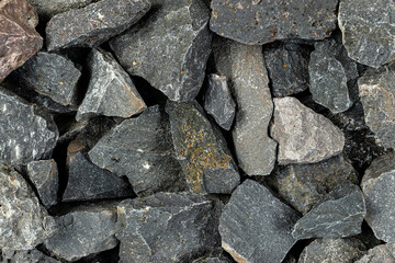 Volcanic basalt stone surface with rough texture, captured close-up
