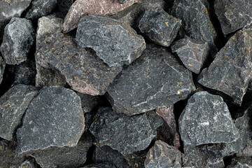 Volcanic basalt stone surface with rough texture, captured close-up
