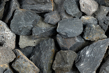 Volcanic basalt stone surface with rough texture, captured close-up