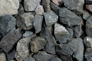 Volcanic basalt stone surface with rough texture, captured close-up