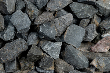 Volcanic basalt stone surface with rough texture, captured close-up