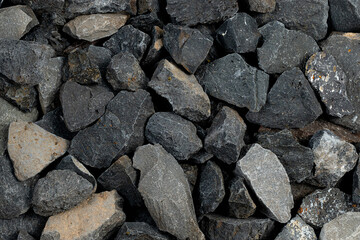 Volcanic basalt stone surface with rough texture, captured close-up