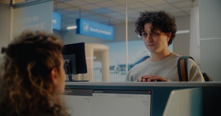 Airport Check-in Counter: Young Man Giving Documents and Airplane Ticket to Airline Worker,...