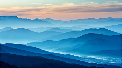Obraz premium Layered Blue Mountain Ranges in Morning Haze Over Water.
