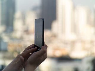 shots of person taking photo with phone of Bangkok City