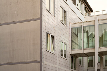 Modern building exterior with glass walkway connecting structures