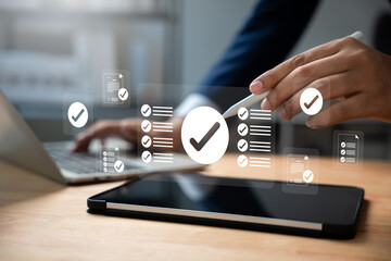 Online survey and checklist assessment, Digital questionnaire, Businessman use tablet to complete a...