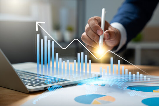 Market research and financial data analysis for growth and strategic planning, Businessman using laptop and tablet to review economic growth chart, Performance dashboard, Analytics for investment.