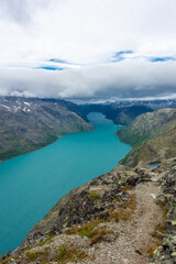 Obraz premium Amazing view of the Besseggen ridge, famous hiking spot in Jotunheimen National Park, admiring two glacial lakes with different colors