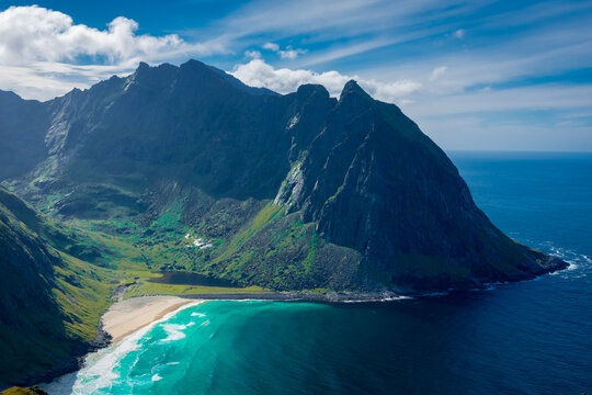 View over the turquoise water of Kvalvika Beach from Ryten Mount, Lofoten Islands,  Norway