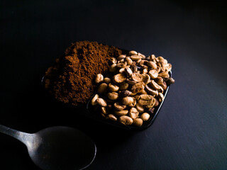 roasted coffee beans on black background