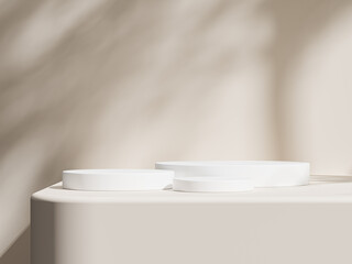 Light beige surface with a pair of white podiums casting delicate shadows of a tree across the scene.