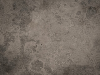 A worn cement surface with uneven color patterns, featuring a mix of light and dark shades for a gritty look.