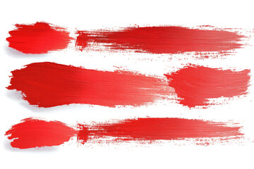 Red paint brushstrokes creating an abstract design on a white background, perfect for artistic and creative projects