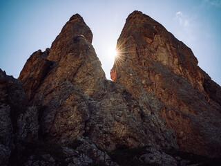 Sunlight breaking through alpine rock formations