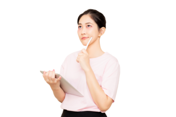 A thoughtful Asian woman in a light pink shirt holds a tablet while contemplating, with a finger on her chin and a slight smile.