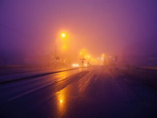 Empty Urban Road Reflecting Twilight Sky After Rain
