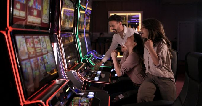 Friends Winning at Slot Machines in a Casino: A Night of Fun and Excitement