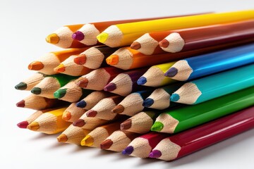 Colorful pencils scattered on a white background showcasing vibrant hues and sharp focus