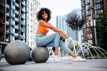 Full body photo of pretty young woman relax have fun wear colorful clothes walk outside urban enjoy...