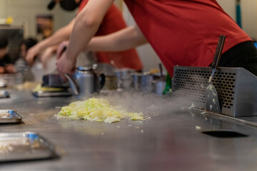 Cabbage teppanyaki is a comforting and flavorful dish that highlights the natural sweetness and crunch of fresh cabbage. Cooked on a sizzling iron plate, the leaves are charred just enough to release