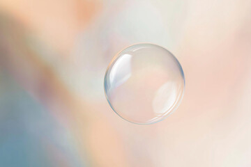 translucent bubble suspended in the air against a soft, pastel background. 