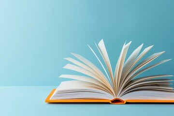 Open book on blue background with pages outspread
