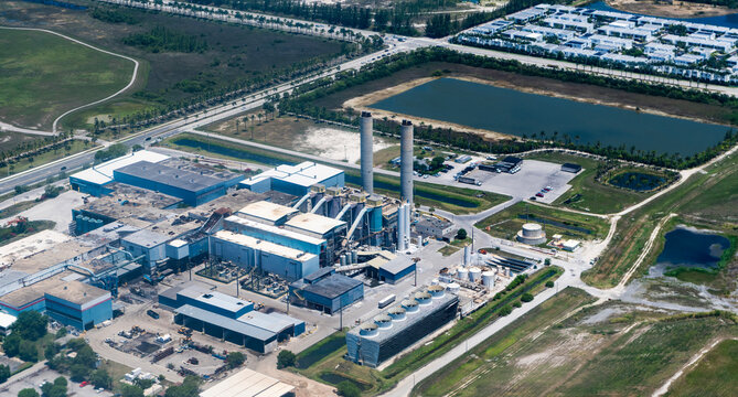 Industry urban area. Industrial zone with waste incineration plant. Incineration facility factory. Waste incineration plant, Miami Dade. Industrial facility of waste recycle. Aerial landscape