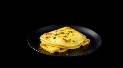 Fluffy Golden Omelet with Herbs &ndash; Studio Shot on Black Background