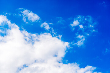 white fluffy clouds in blue sky
