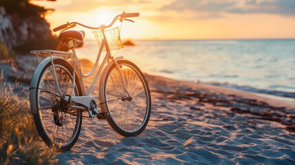 Fototapeta premium Coastal Ride into the Sunset: A classic bicycle rests gracefully on a sandy beach, bathed in the warm hues of a setting sun, capturing a sense of freedom and coastal tranquility.