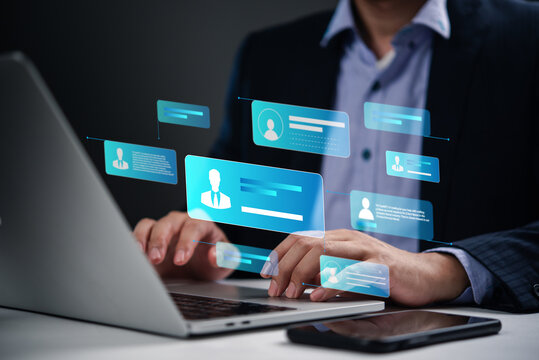 person working on a laptop with digital profile icons, focusing on online communication and cybersecurity. virtual networking, digital identity, and personal data security.