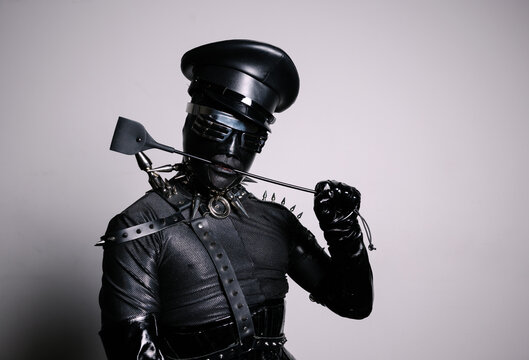 Mystery Person in Unique Leather Outfit and Accessories