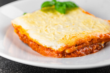 Lasagna meat bechamel, tomato sauce, vegetable dish vegetables organic product fresh tasty gourmet food background on the table rustic food top view copy space