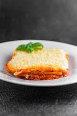 Lasagna meat bechamel, tomato sauce, vegetable dish vegetables organic product fresh tasty gourmet food background on the table rustic food top view copy space