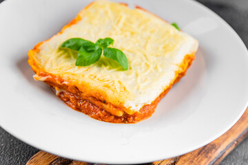 Lasagna meat bechamel, tomato sauce, vegetable dish vegetables organic product fresh tasty gourmet food background on the table rustic food top view copy space