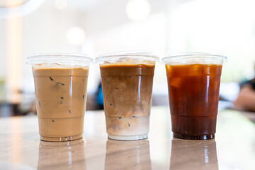 Close up glass of three ice coffee on table of a coffee shop summer, menu photography