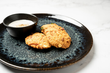 Delicious and crispy masala vada, a popular south indian fritter, served with coconut chutney